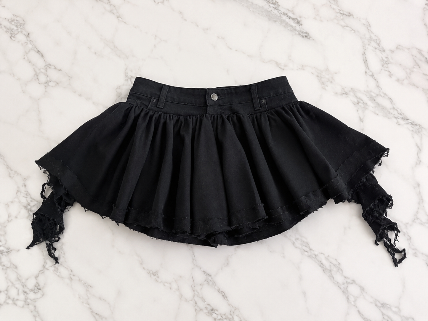 Black knit & denim flared mini skirt with side distressed drape