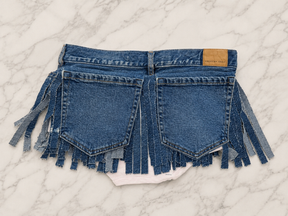 Mini denim fringe skirt with large back pockets